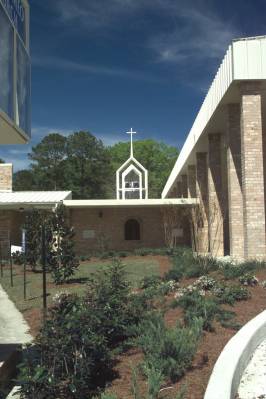 The left side of the church & a distant view of the Marian Grotto